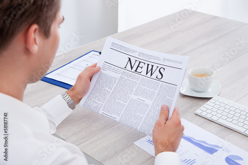 Photo: Businessman Reading Newspaper Businessman Reading Newspaper
