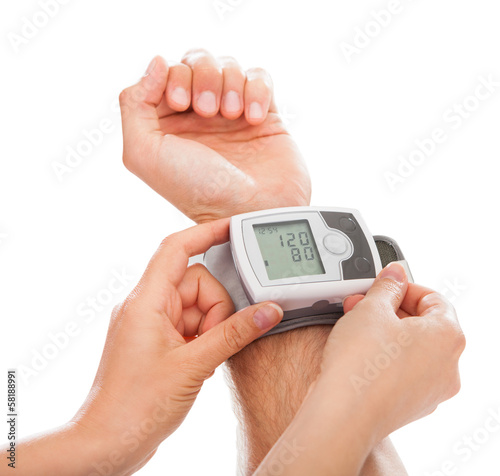 Photo: Person Checking Blood Pressure Person Checking Blood Pressure