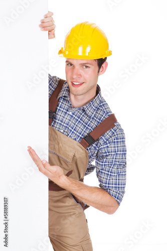 Photo: Male Worker Holding Blank Placard Male Worker Holding Blank Placard