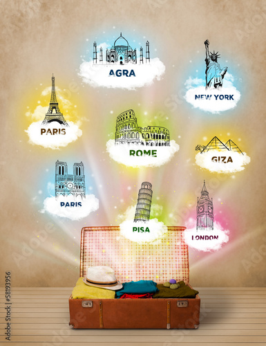 Photo: Tourist suitcase with famous landmarks around the world Tourist suitcase with famous landmarks around the world