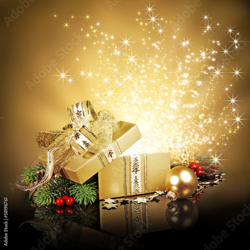 Photo: Christmas surprise gift box, exploding with glitters and stars Christmas surprise gift box, exploding with glitters and stars
