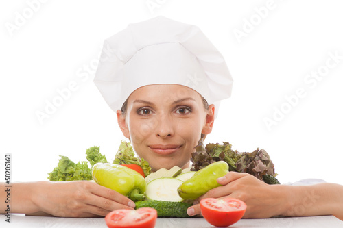 Photo: woman chef or cook and vegetables woman chef or cook and vegetables