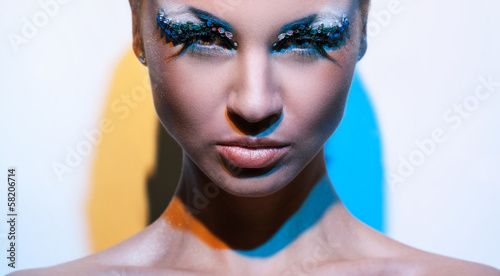 Photo: Beautiful caucasian woman with artistic makeup Beautiful caucasian woman with artistic makeup