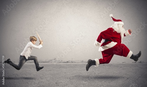 Photo: Angry child with Santa Claus Angry child with Santa Claus