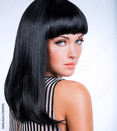 Photo: Beautiful brunette woman with long black straight hair Beautiful brunette woman with long black straight hair