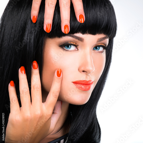Photo: portrait of a woman with red nails and glamour makeup portrait of a woman with red nails and glamour makeup
