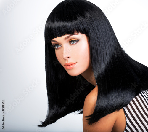 Photo: Beautiful brunette woman with long black straight hair Beautiful brunette woman with long black straight hair