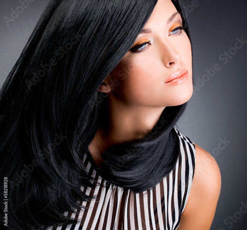 Photo: Beautiful brunette woman with long black straight hair Beautiful brunette woman with long black straight hair