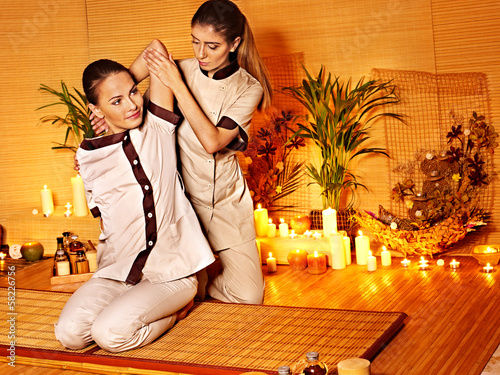 Photo: Therapist giving stretching massage to woman. Therapist giving stretching massage to woman.
