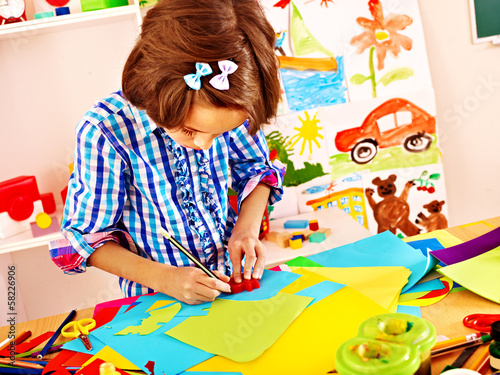 Photo: Child with scissor at school. Child with scissor at school.