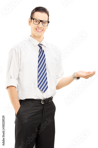 Photo: Young smiling male gesturing with his hand Young smiling male gesturing with his hand