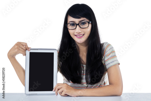 Photo: Female student showing a digital tablet Female student showing a digital tablet