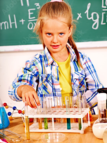 Photo: Child in chemistry class. Child in chemistry class.