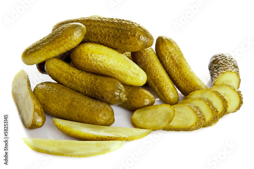 Photo: pickled cucumbers. Gherkins on a white background pickled cucumbers. Gherkins on a white background