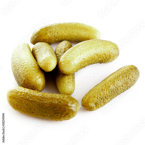 Photo: pickled cucumbers. Gherkins on a white background pickled cucumbers. Gherkins on a white background