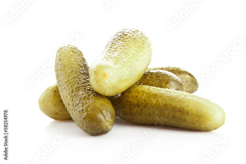 Photo: pickled cucumbers. Gherkins on a white background pickled cucumbers. Gherkins on a white background