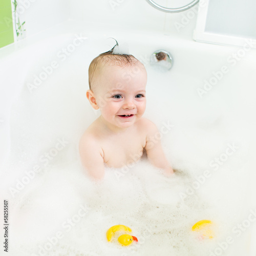 Photo: smiling baby taking bath smiling baby taking bath