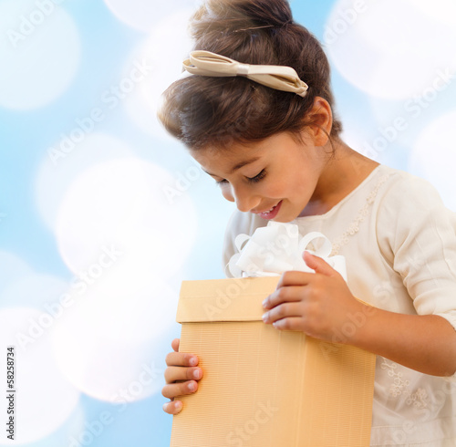 Photo: happy child girl with gift box happy child girl with gift box