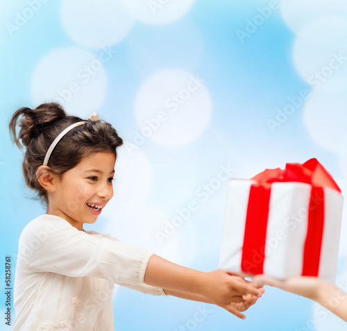 Photo: happy child girl with gift box happy child girl with gift box