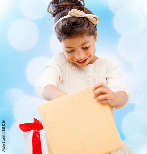 Photo: happy child girl with gift box happy child girl with gift box