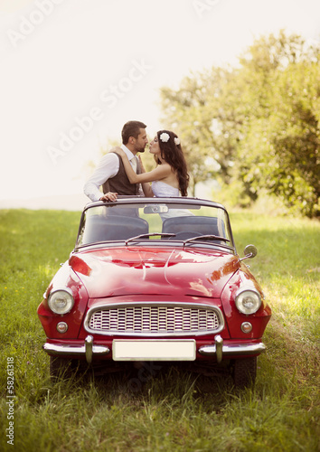 Photo: Wedding car with bride and groom Wedding car with bride and groom