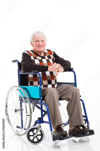 Photo: senior man sitting on a wheelchair senior man sitting on a wheelchair