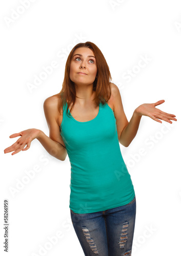 Photo: woman throws her hands she did not understand surprised looks up woman throws her hands she did not understand surprised looks up