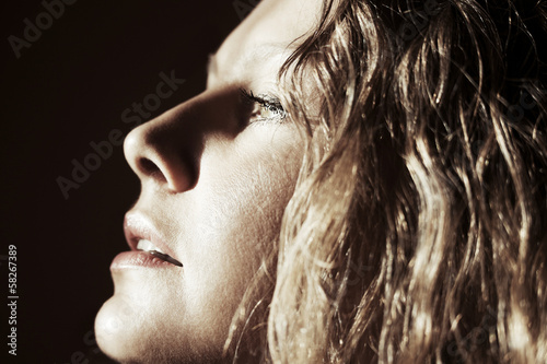 Photo: Sad beautiful woman looking away Sad beautiful woman looking away