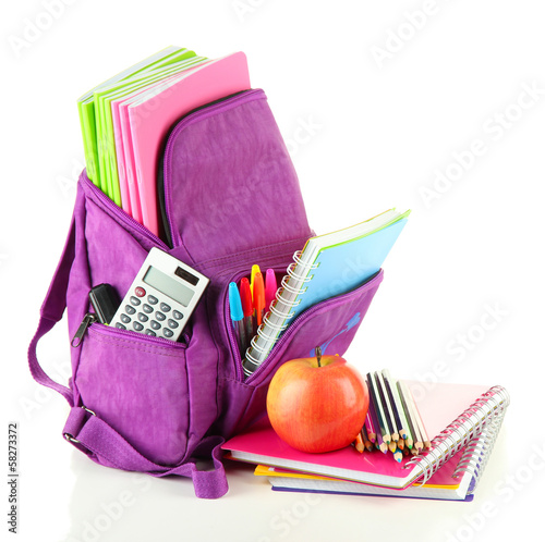 Photo: Purple backpack with school supplies isolated on white Purple backpack with school supplies isolated on white
