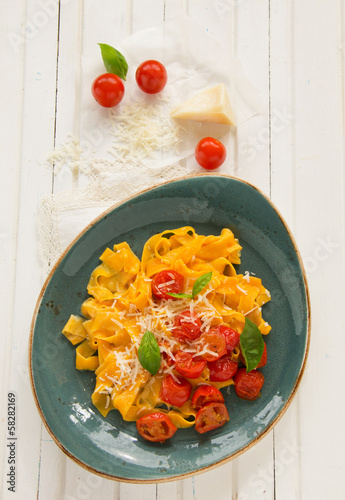 Photo: Pumpkin pasta with tomato and basil. Pumpkin pasta with tomato and basil.