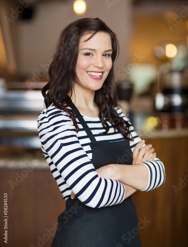 Photo: Happy Waitress Standing In Cafe Happy Waitress Standing In Cafe