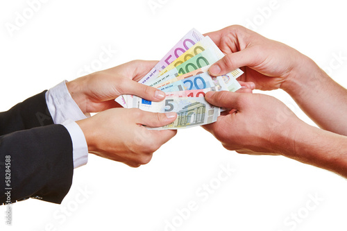 Photo: Hands pulling on Euro money bills Hands pulling on Euro money bills
