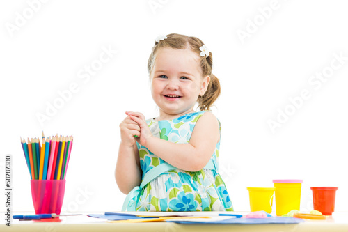 Photo: happy kid drawing and making by hands happy kid drawing and making by hands