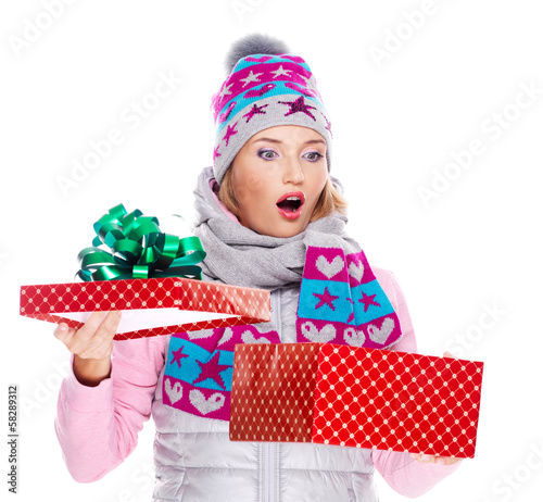 Photo: Photo of happy surprised woman with a christmas gift Photo of happy surprised woman with a christmas gift