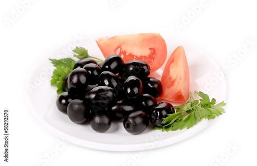 Photo: Black olives with tomatoes and parsley. Black olives with tomatoes and parsley.
