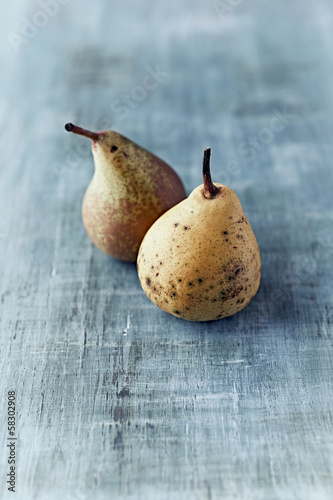 Photo: Two autumn pears on painted wood Two autumn pears on painted wood