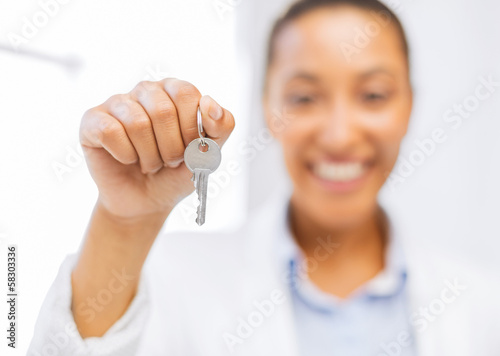 Photo: woman hand holding house keys woman hand holding house keys