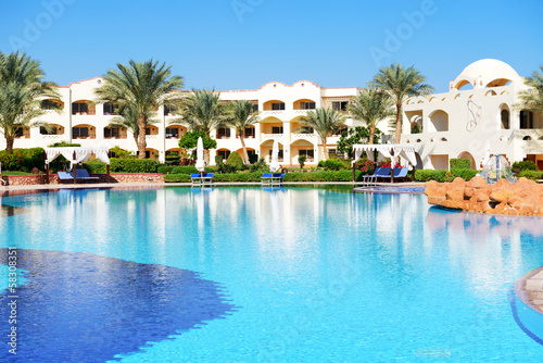 Photo: Sunbeds near swimming pool at luxury hotel, Sharm el Sheikh, Egy Sunbeds near swimming pool at luxury hotel, Sharm el Sheikh, Egy