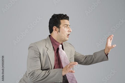 Photo: Businessman looking scared Businessman looking scared