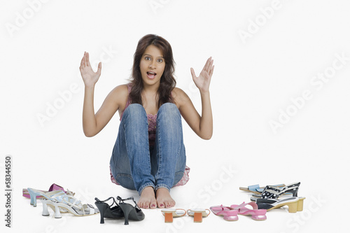 Photo: Woman choosing footwear Woman choosing footwear