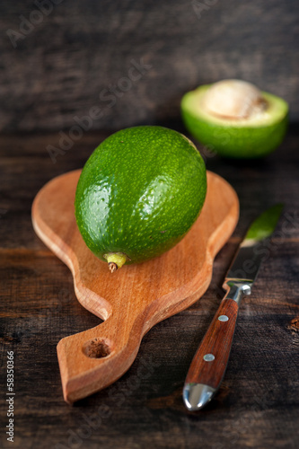 Photo: Avocado on a wooden board Avocado on a wooden board