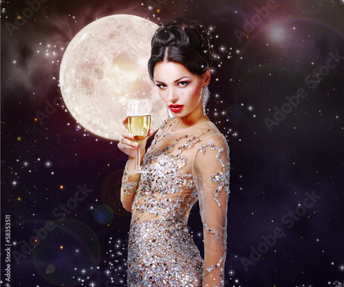 Photo: Expressive Lady with Wineglass in Golden Dress Expressive Lady with Wineglass in Golden Dress
