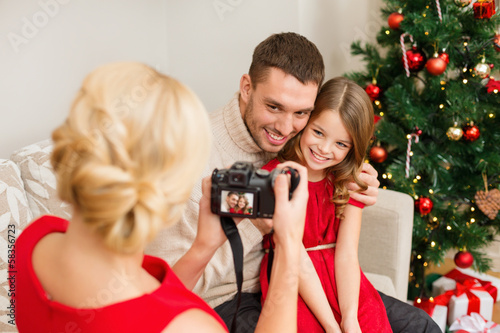 Photo: mother taking picture of father and daughter mother taking picture of father and daughter
