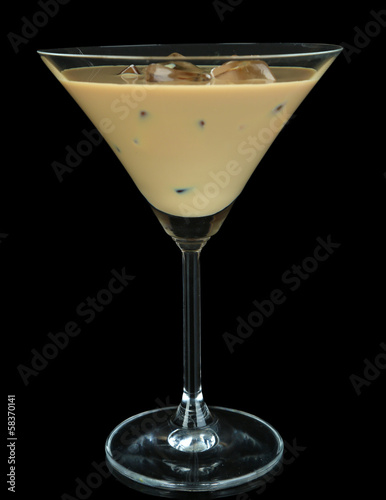 Photo: Baileys liqueur in glass isolated on black Baileys liqueur in glass isolated on black