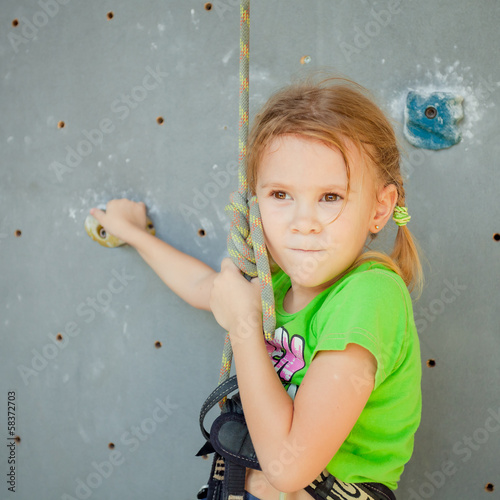Photo: Little Girl Climbing Rock Wall Little Girl Climbing Rock Wall