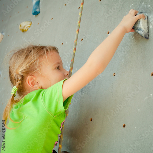 Photo: Little Girl Climbing Rock Wall Little Girl Climbing Rock Wall