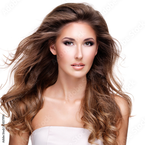 Photo: Beautiful woman with long wavy brown hair Beautiful woman with long wavy brown hair