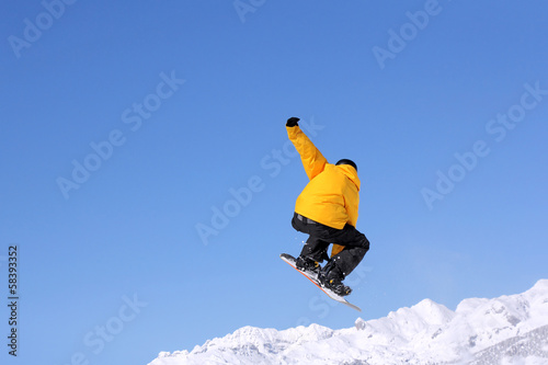 Photo: Snowboarder jumping Snowboarder jumping