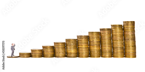 Photo: man at the foot of the mountain of coins concept man at the foot of the mountain of coins concept