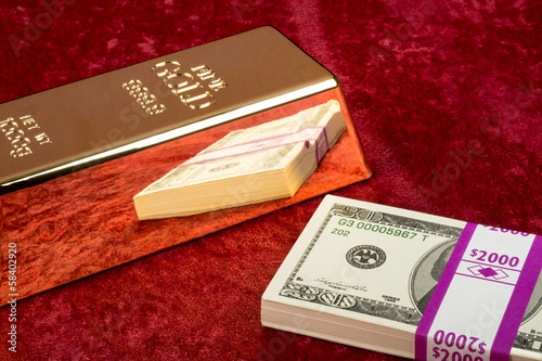 Photo: Gold bar and cash Gold bar and cash
